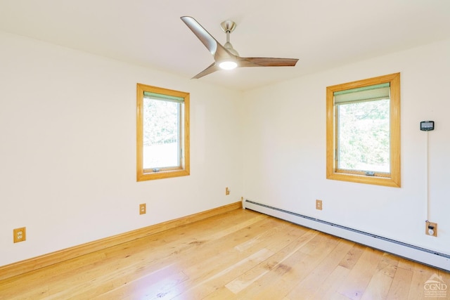 38 Cheviot Rd Unit 8, Germantown, NY 12526 - empty room featuring baseboard heating, healthy amount of natural light, light wood finished floors, and ceiling fan