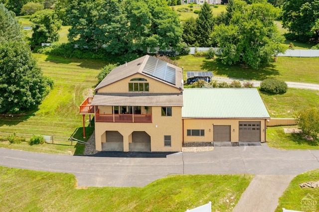 38 Cheviot Rd Unit 8, Germantown, NY 12526 - view of front of home with solar panels, metal roof, a wooden deck, and view of wooded area