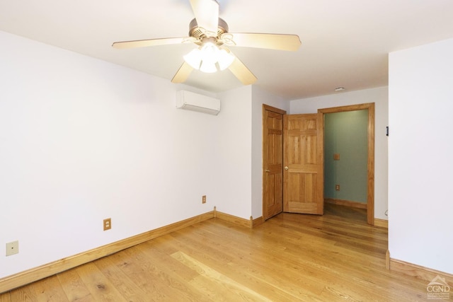 38 Cheviot Rd Unit 8, Germantown, NY 12526 - spare room featuring an AC wall unit, baseboards, light wood-type flooring, and ceiling fan