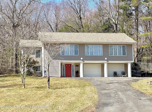 258 Watson Hollow Rd, West Shokan, NY 12494 - view of front of property featuring asphalt driveway, an attached garage, and a front yard