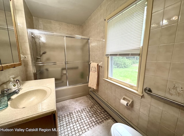 258 Watson Hollow Rd, West Shokan, NY 12494 - full bath featuring tile walls, vanity, toilet, and bath / shower combo with glass door