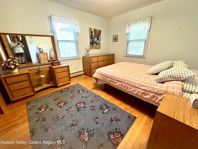 258 Watson Hollow Rd, West Shokan, NY 12494 - bedroom with baseboard heating and light wood-style flooring