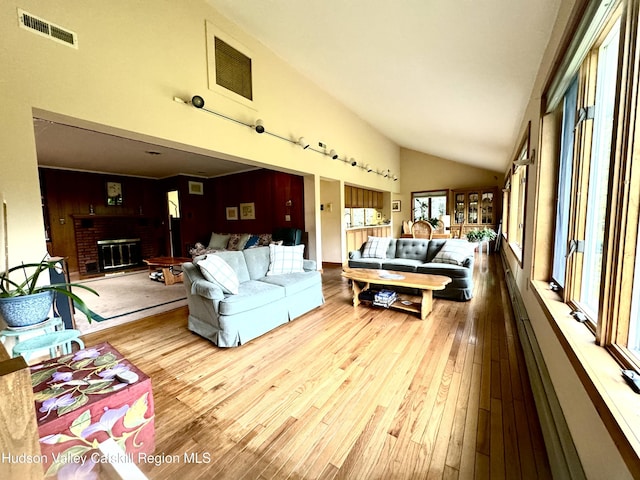 258 Watson Hollow Rd, West Shokan, NY 12494 - living room with hardwood / wood-style floors, a fireplace, and high vaulted ceiling
