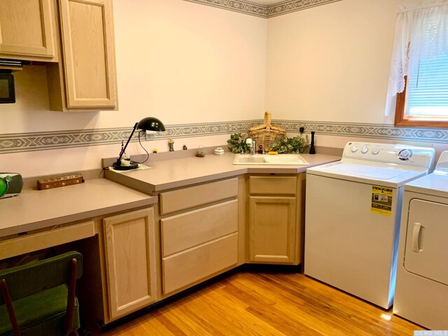 160 Willowbrook Rd, Hudson, NY 12534 - laundry area featuring washing machine and dryer, cabinet space, and light wood-style floors