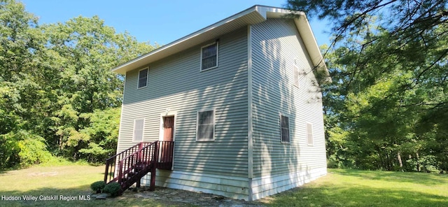 view of property exterior featuring a yard