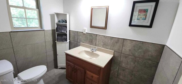 374 N Ridge Rd, Hannacroix, NY 12087 - half bath with tile walls, wainscoting, vanity, and tile patterned floors