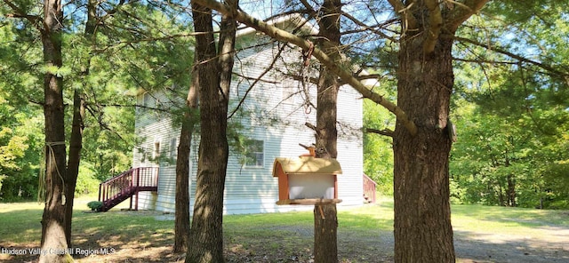 view of home's exterior with a lawn