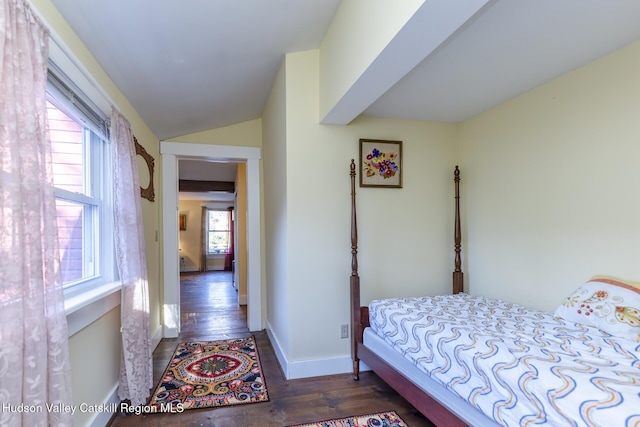 bedroom with dark hardwood / wood-style flooring