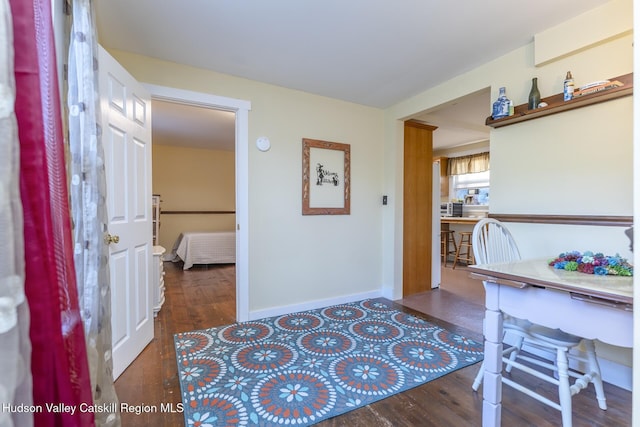 dining area with dark hardwood / wood-style floors