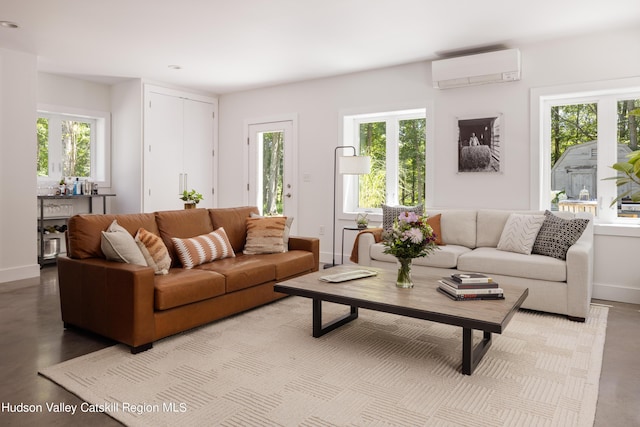 living room featuring a healthy amount of sunlight and a wall mounted air conditioner