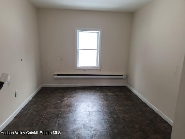 empty room featuring baseboard heating