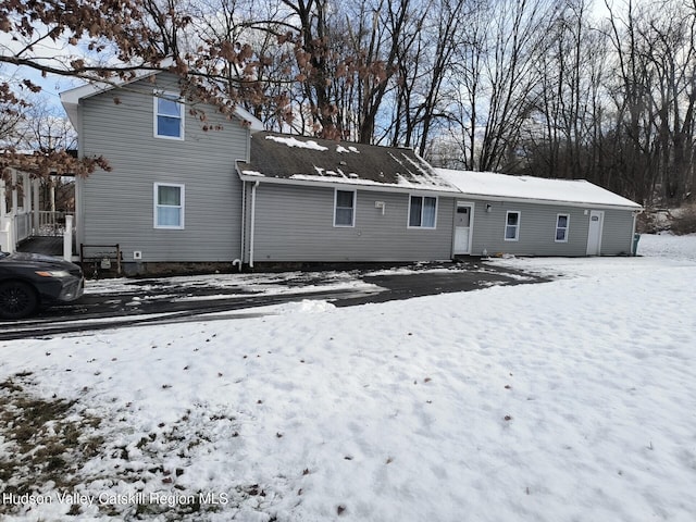 view of snow covered house