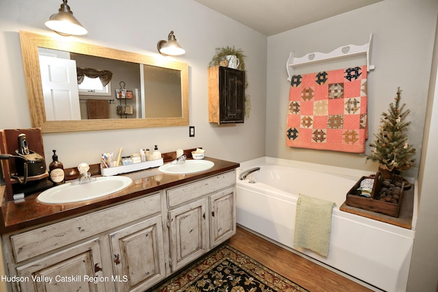 199 Echo Hill Rd, Saugerties, NY 12477 - full bath featuring a sink, double vanity, a bath, and wood finished floors