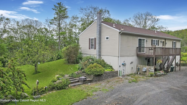 199 Echo Hill Rd, Saugerties, NY 12477 - view of side of property with a yard, a deck, a chimney, and stairs