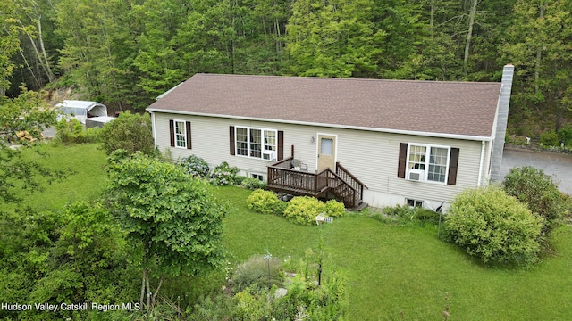 199 Echo Hill Rd, Saugerties, NY 12477 - manufactured / mobile home with a wooded view, a chimney, a front yard, and a wooden deck