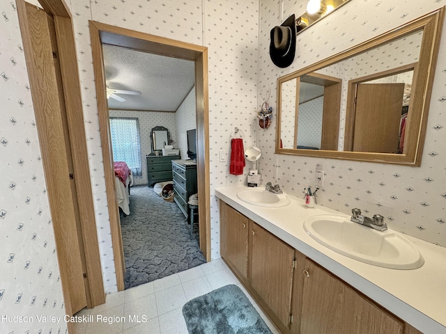 199 Echo Hill Rd, Saugerties, NY 12477 - bathroom with connected bathroom, double vanity, wallpapered walls, and a sink