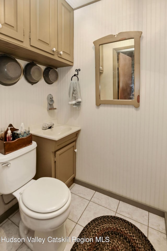 199 Echo Hill Rd, Saugerties, NY 12477 - half bathroom featuring baseboards, tile patterned flooring, vanity, and toilet