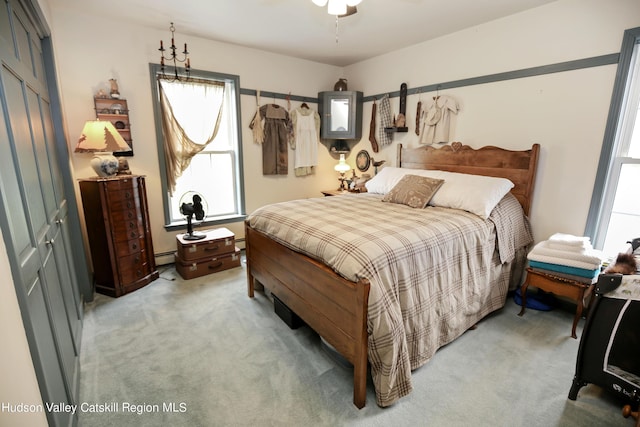 199 Echo Hill Rd, Saugerties, NY 12477 - bedroom with light colored carpet, multiple windows, and a baseboard radiator