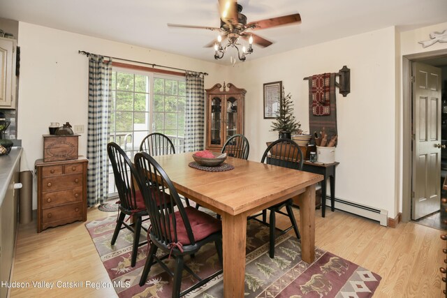 199 Echo Hill Rd, Saugerties, NY 12477 - dining room featuring ceiling fan, a baseboard heating unit, and light wood-style floors