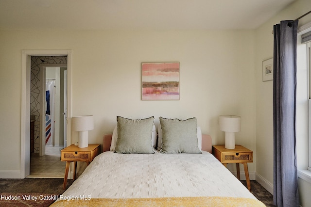 bedroom featuring baseboards