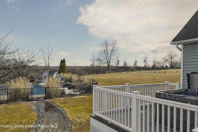 view of yard featuring fence and a deck