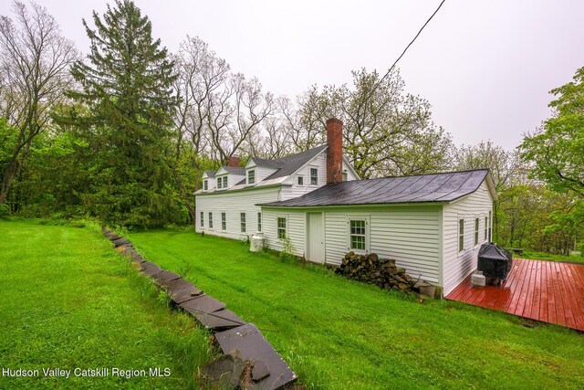 1250 County Route 351, Rensselaerville, NY 12147 - rear view of house with a wooden deck, a yard, and a chimney