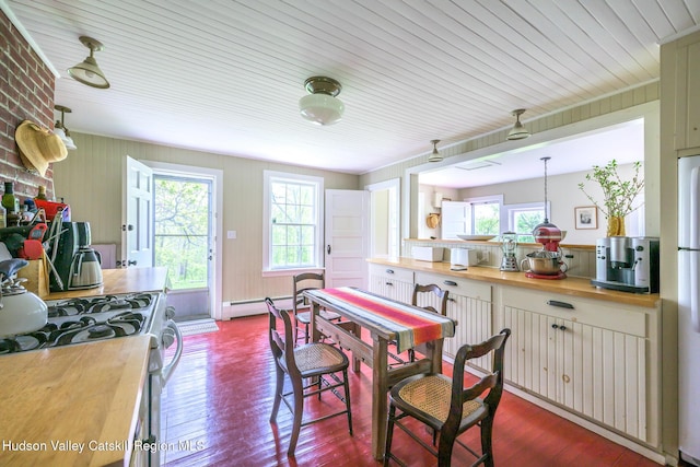 1250 County Route 351, Rensselaerville, NY 12147 - dining area featuring plenty of natural light, a baseboard heating unit, dark wood-style flooring, and wooden ceiling