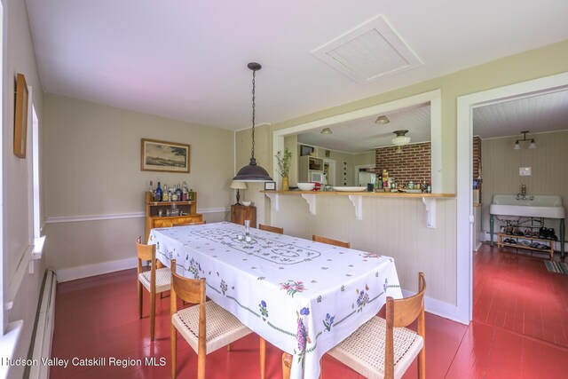 1250 County Route 351, Rensselaerville, NY 12147 - dining space with dark wood-style flooring and baseboard heating