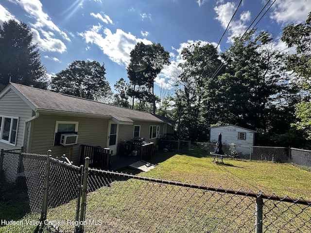 rear view of house featuring a yard and cooling unit