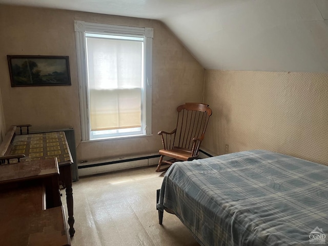 carpeted bedroom with a baseboard heating unit and vaulted ceiling