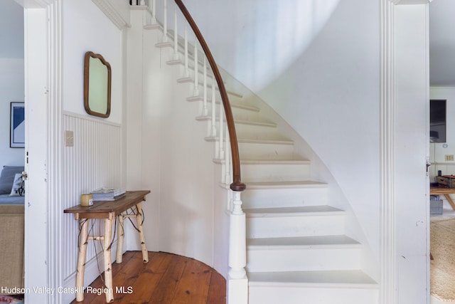 stairs with hardwood / wood-style flooring