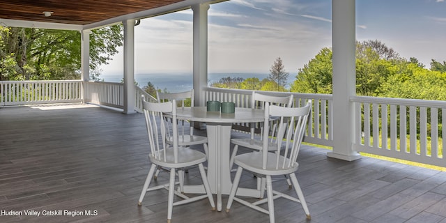 wooden terrace with a water view