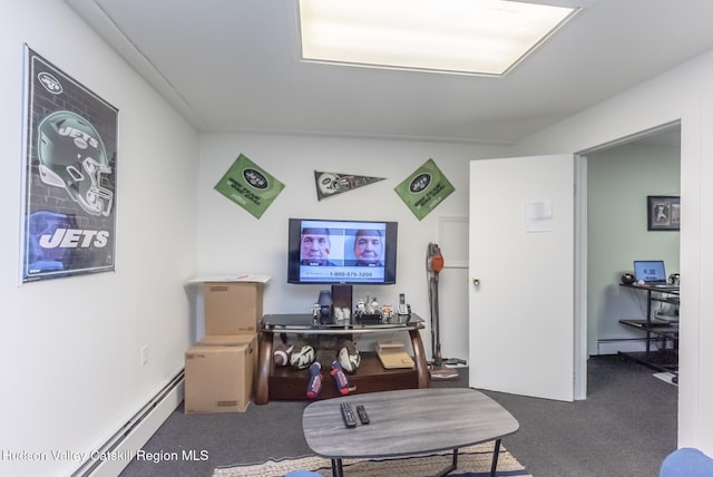 carpeted living room featuring a baseboard heating unit