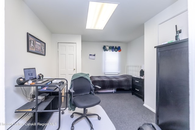carpeted bedroom featuring baseboards