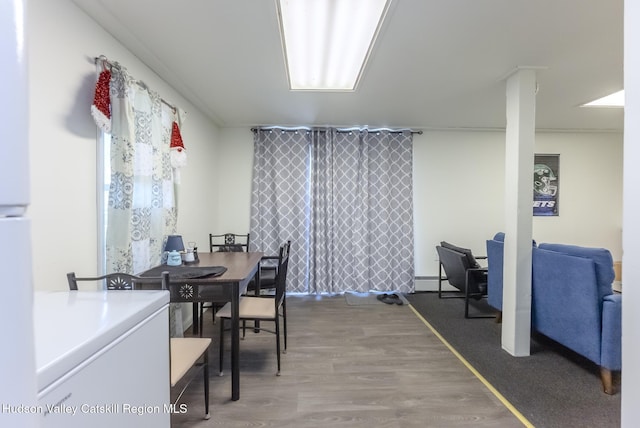 dining space featuring wood finished floors