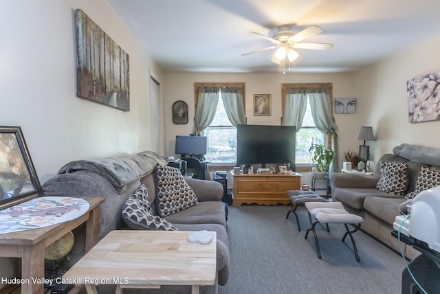 carpeted living room with ceiling fan