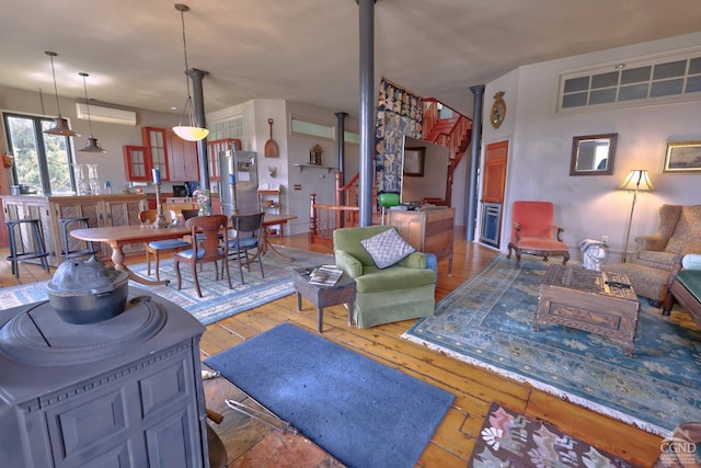 380 Main St, New Baltimore, NY 12124 - living room featuring wood-type flooring and a wall mounted air conditioner