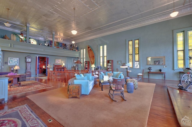 380 Main St, New Baltimore, NY 12124 - living area with wood finished floors, ornamental molding, and an ornate ceiling