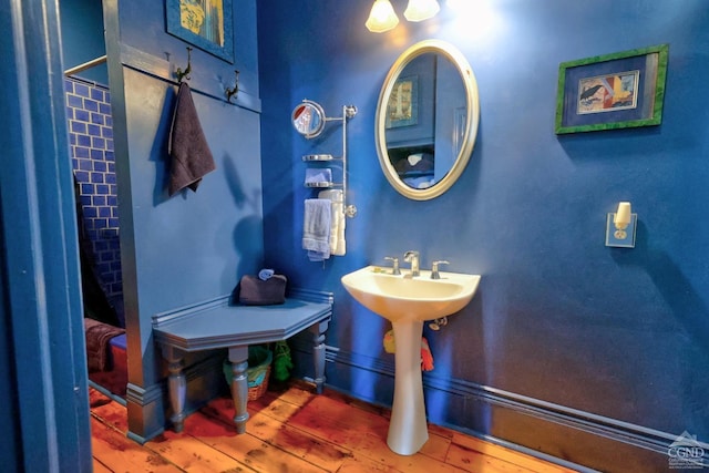 380 Main St, New Baltimore, NY 12124 - bathroom with baseboards and wood finished floors