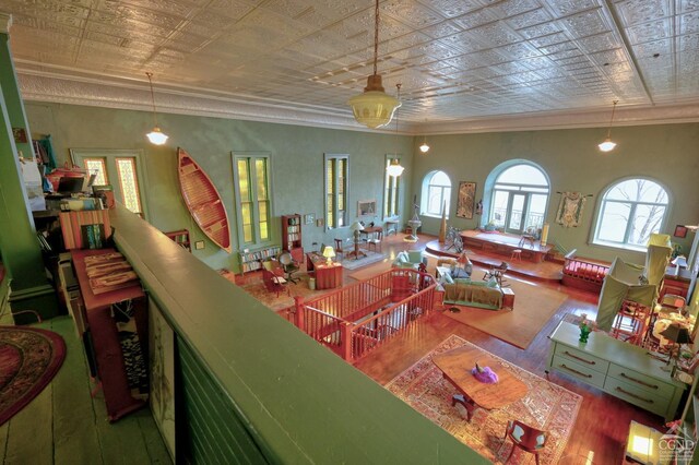 380 Main St, New Baltimore, NY 12124 - living area with hardwood / wood-style flooring, an ornate ceiling, and ornamental molding