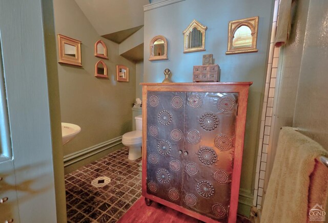 380 Main St, New Baltimore, NY 12124 - full bath featuring toilet, vaulted ceiling, a shower, and baseboards
