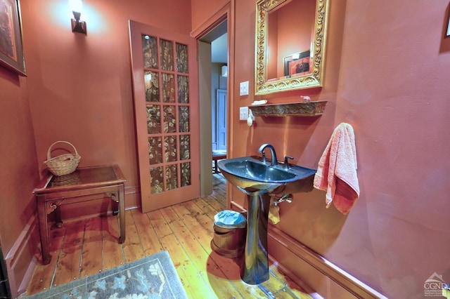380 Main St, New Baltimore, NY 12124 - bathroom featuring hardwood / wood-style flooring and baseboards