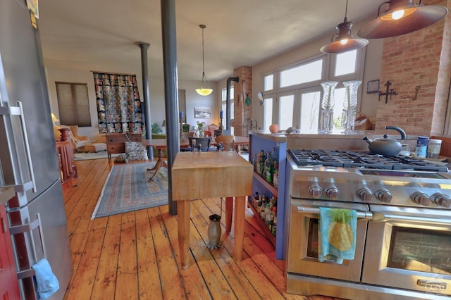 380 Main St, New Baltimore, NY 12124 - kitchen with stainless steel appliances, light wood-style flooring, and hanging light fixtures