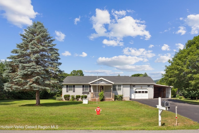 109 Union St, Middleburgh, NY 12122 - single story home featuring an attached garage, covered porch, driveway, and a front lawn