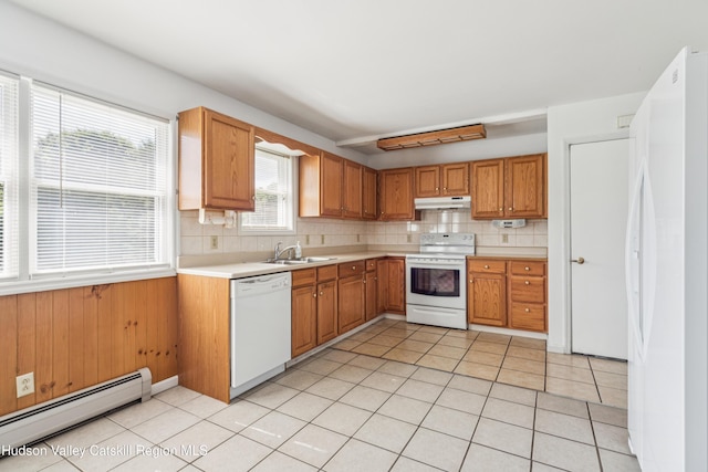109 Union St, Middleburgh, NY 12122 - kitchen featuring white appliances, baseboard heating, under cabinet range hood, light countertops, and tasteful backsplash