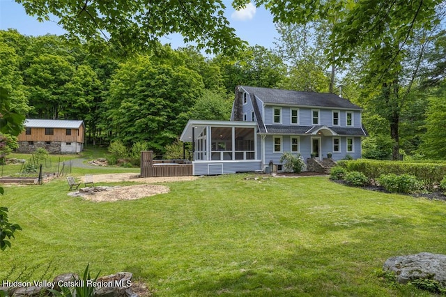 370 N Elting Corners Rd, Highland, NY 12528 - view of front facade featuring a sunroom, a front yard, and a shingled roof