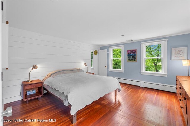 370 N Elting Corners Rd, Highland, NY 12528 - bedroom featuring a baseboard radiator and wood-type flooring