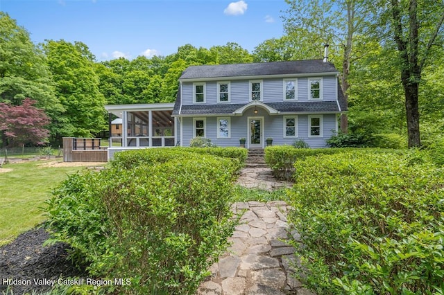 370 N Elting Corners Rd, Highland, NY 12528 - view of front facade with a sunroom, a shingled roof, and a front yard