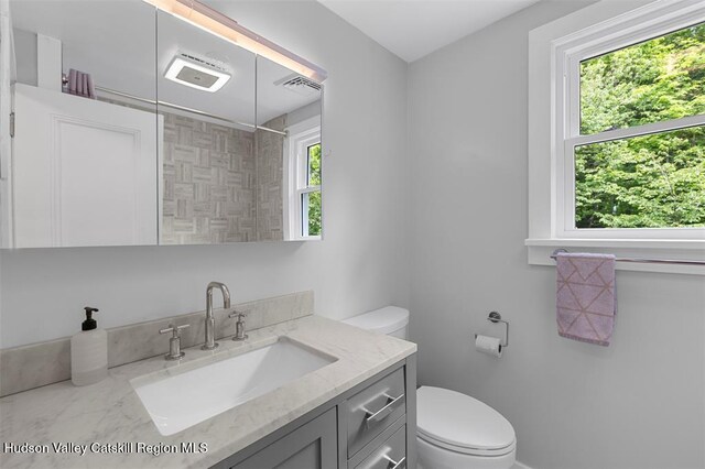 370 N Elting Corners Rd, Highland, NY 12528 - full bathroom with vanity, toilet, and a tile shower