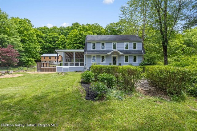 370 N Elting Corners Rd, Highland, NY 12528 - rear view of house featuring a sunroom, a lawn, and a wooded view